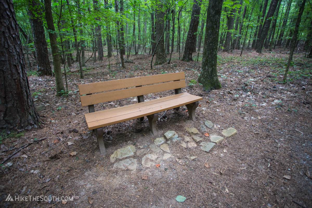 Kennesaw Mountain Environmental Loop & 24 Gun Trail. 
This trail is flat so you won't need the benches to catch your breath, but to just stop and enjoy nature.