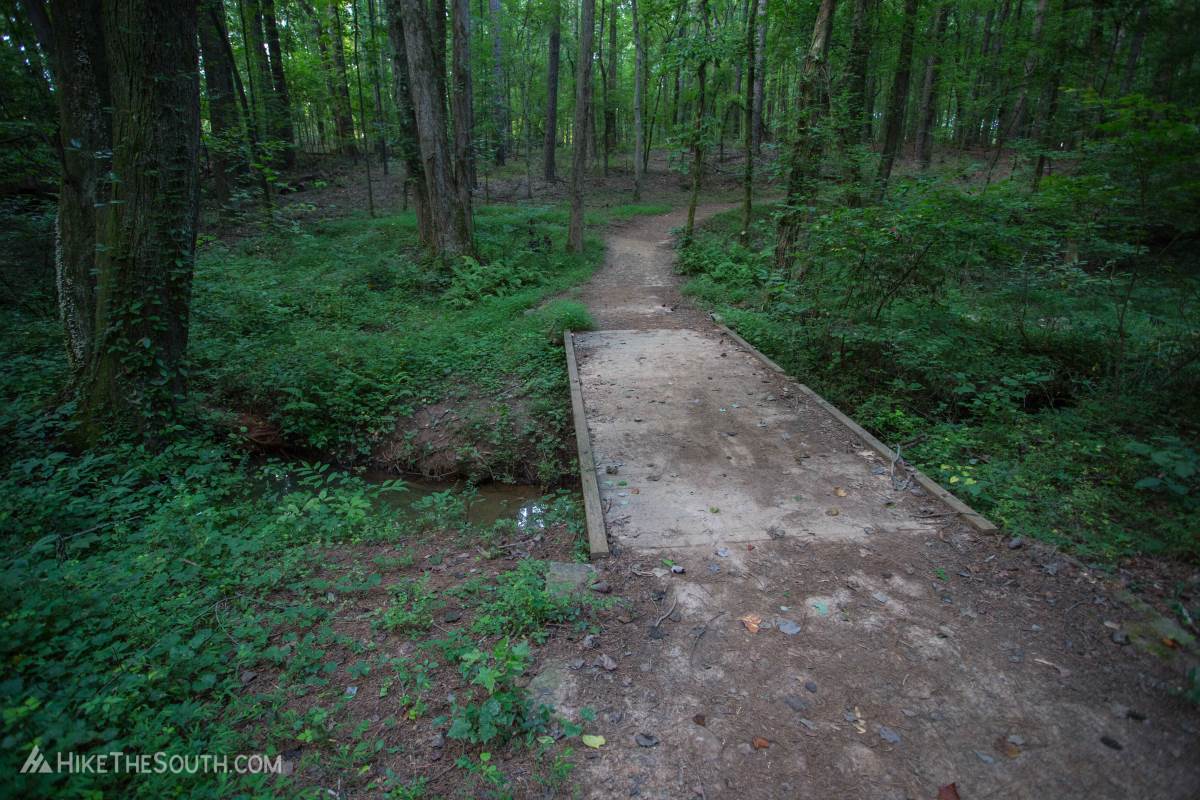 Kennesaw Mountain Environmental Loop & 24 Gun Trail. 
The trail crosses over several small creeks by way of footbridges.