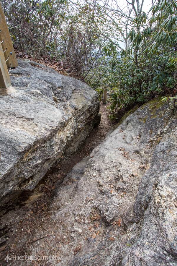 Whiteside Mountain. 
Head down the crack in the rock for a great view of the cliffs. Don't worry, it's fenced as well.
